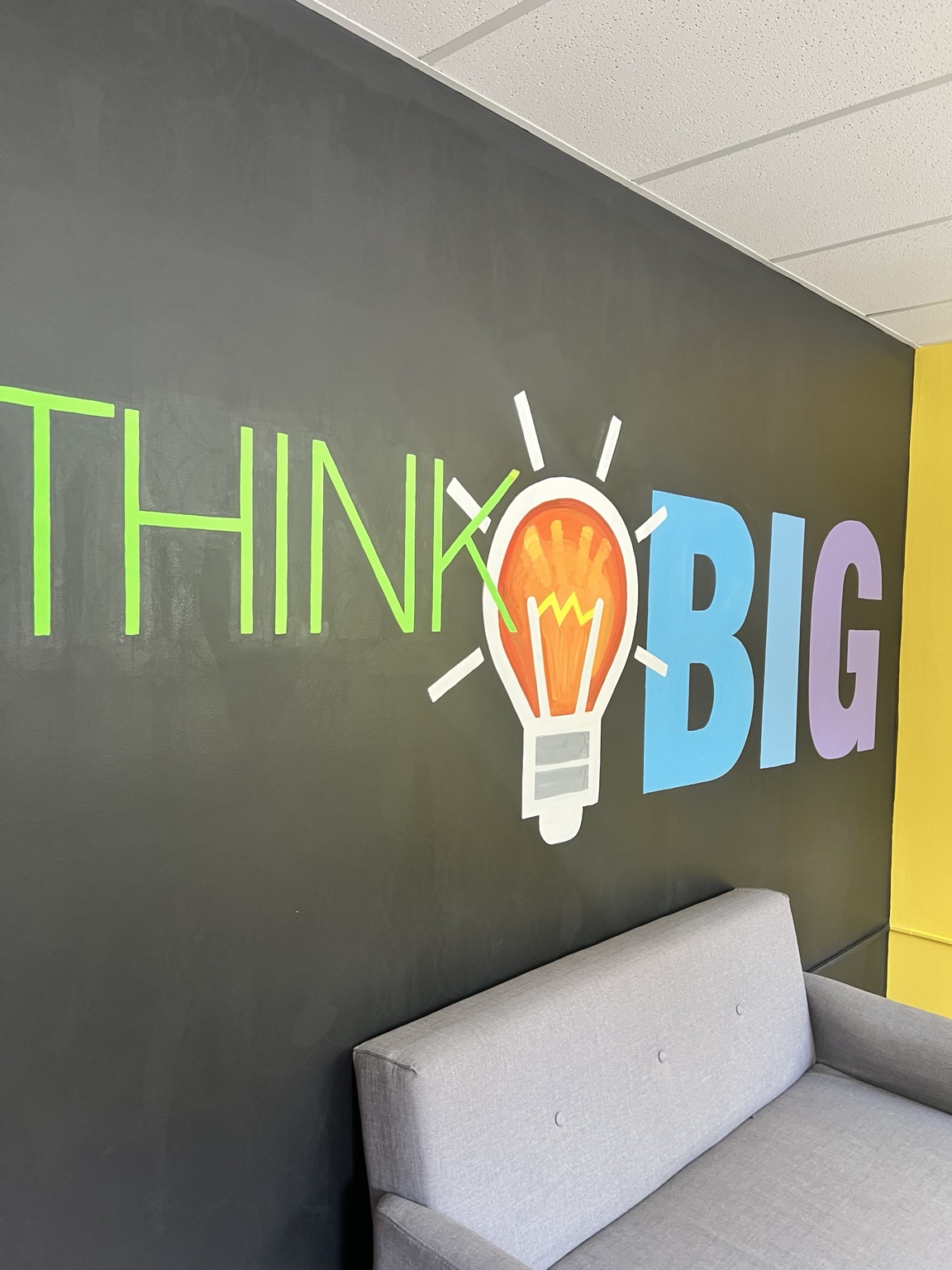 Colorful Think Big mural and seating in the Building Blocks eSports space